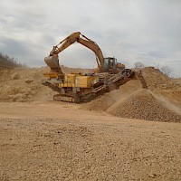 Excavator Feeding Crusher